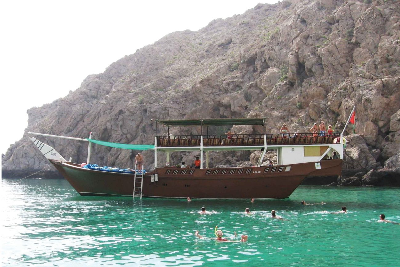 Musandam Dibba Tour - dhow with swimmers